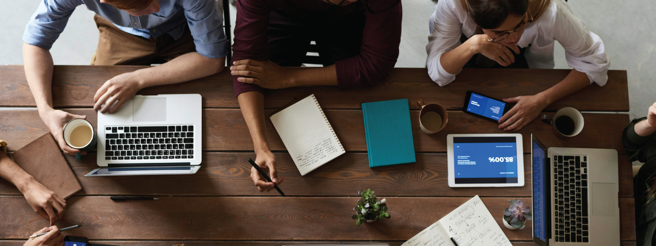 Business employees working on table