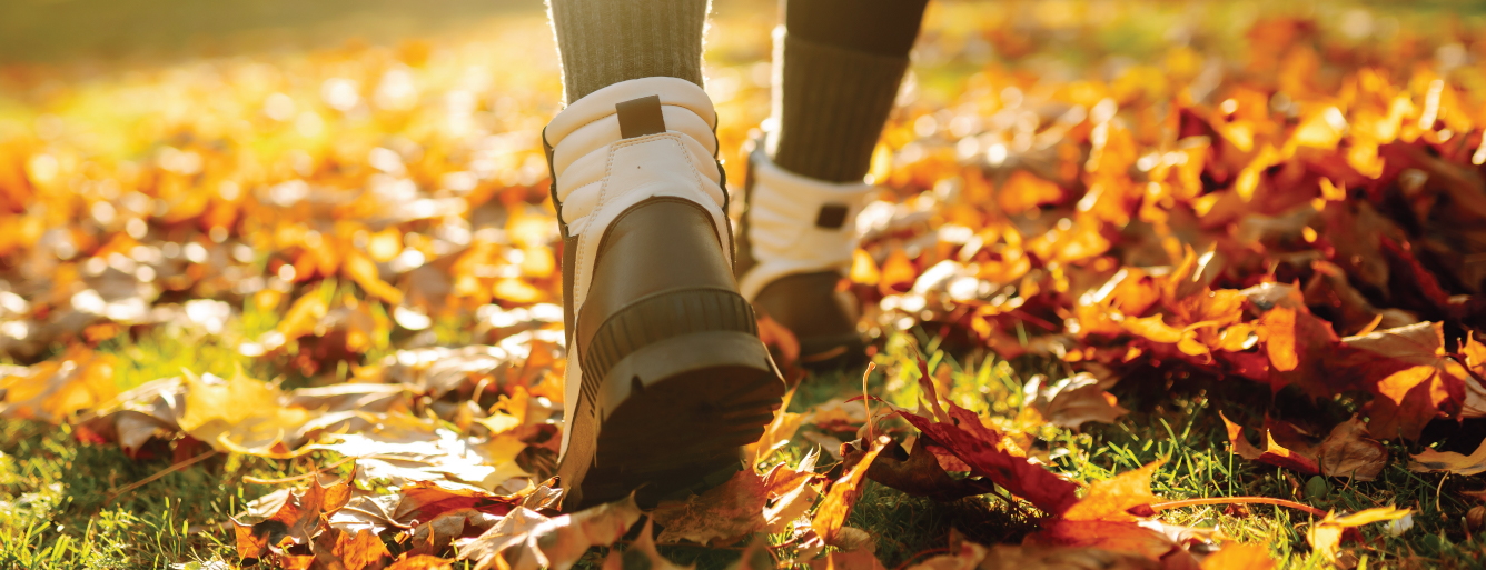Girl walking on leaves